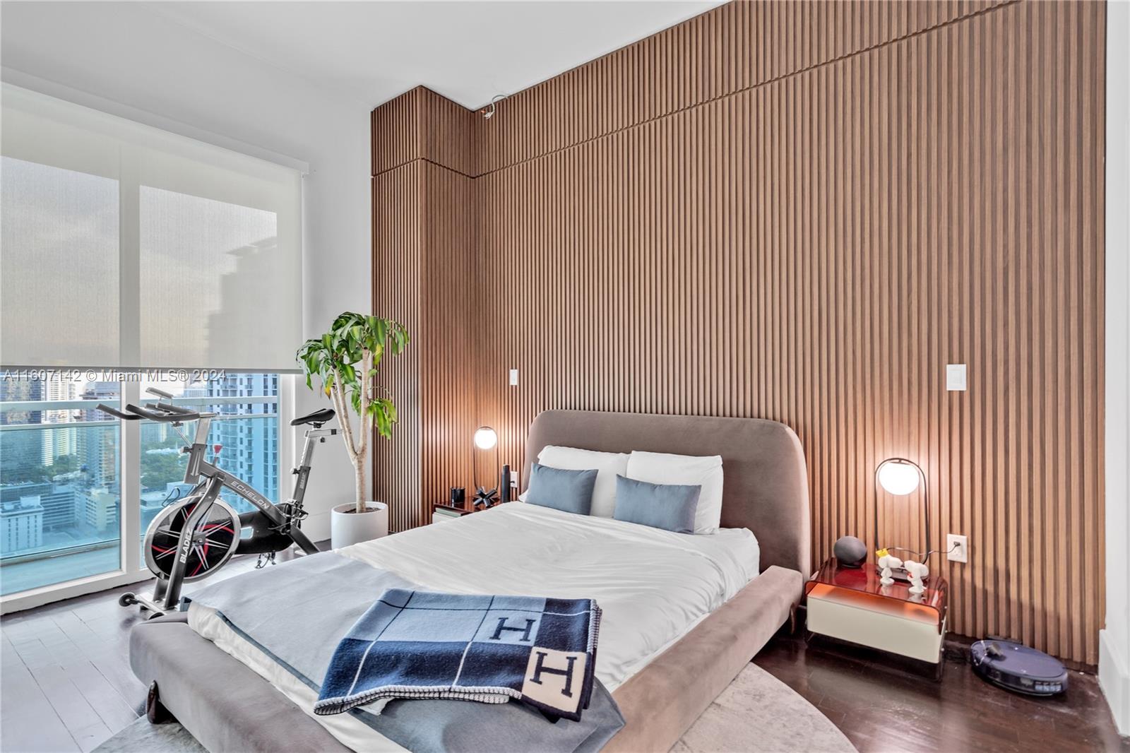 951 Brickell Avenue, Unit PH4111 Miami, FL 33131 - Photo 20 of 32 a bedroom with a bed and a chair