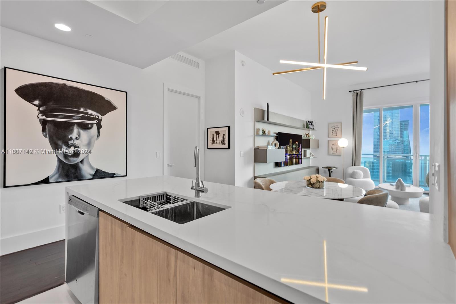 951 Brickell Avenue, Unit PH4111 Miami, FL 33131 - Photo 22 of 32 a kitchen with a stove and a refrigerator