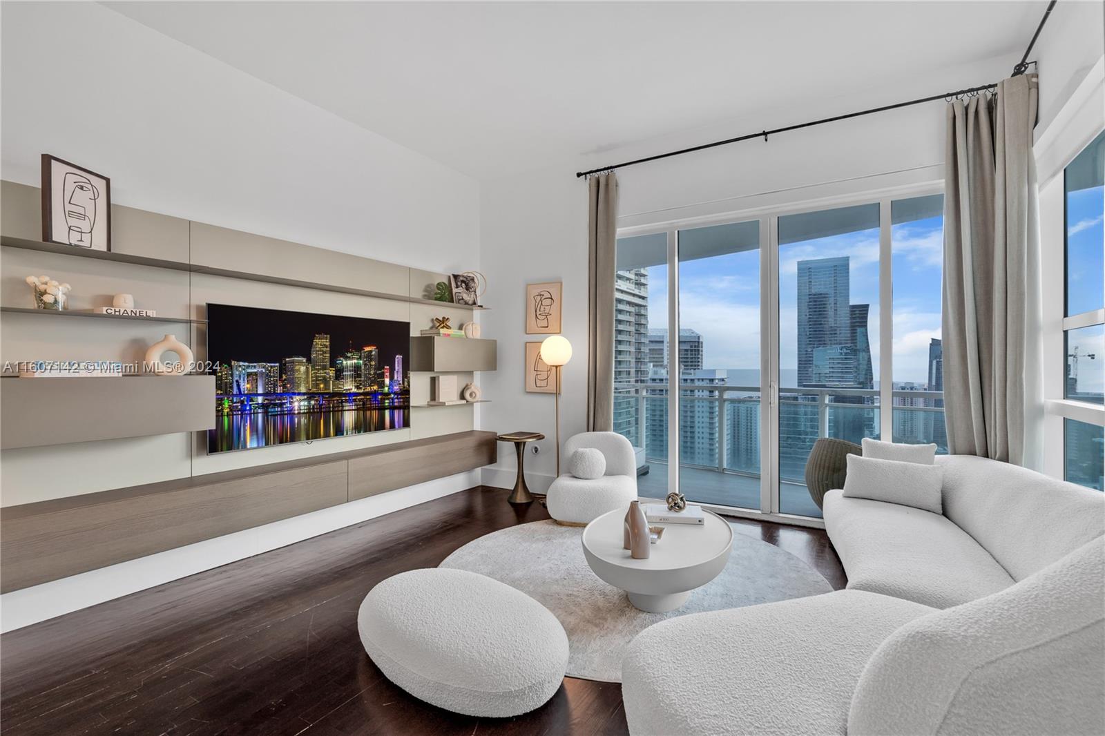 951 Brickell Avenue, Unit PH4111 Miami, FL 33131 - Photo 8 of 32 a living room with furniture and a large window