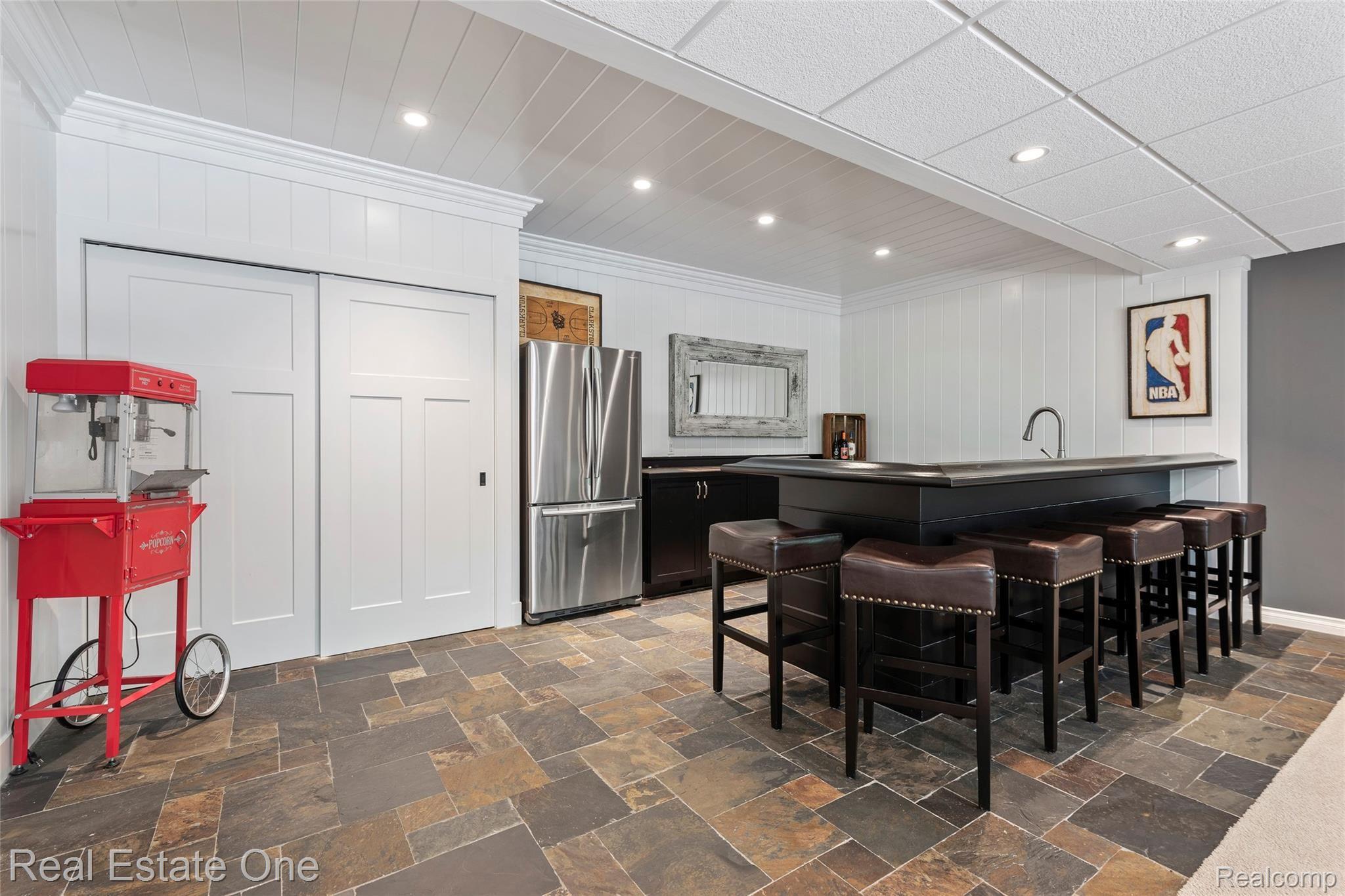 7807 Fieldstone Ridge Clarkston, MI 48348 - Photo 56 of 59 Wet Bar offers lots of space for seating (refrigerator is not included)