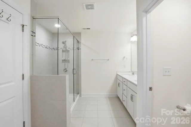 a bathroom with a sink and shower