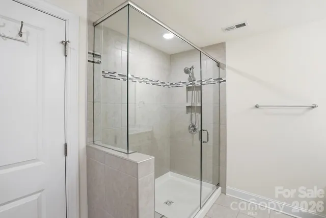 a bathroom with a shower and toilet