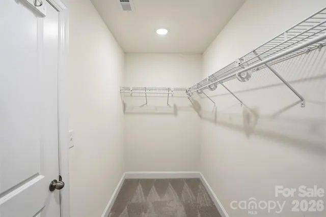 a view of a room with racks on the wall