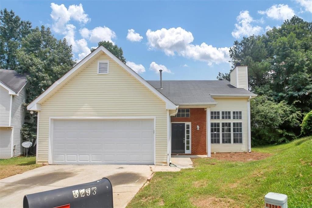 3293 Deer Pause Lane Decatur, GA 30034 - Photo 1 of 1 a front view of a house with a garden and yard