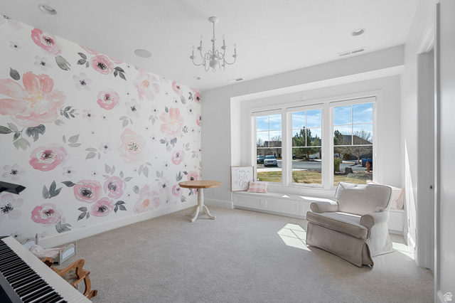 2917 Old Farm Road Washington, UT 84780 - Photo 68 of 105 Sitting room featuring wallpapered walls, suspended lighting, and carpet flooring