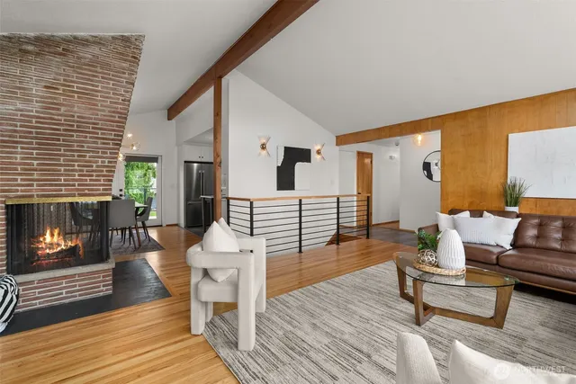 a kitchen with stainless steel appliances a refrigerator stove microwave and cabinets