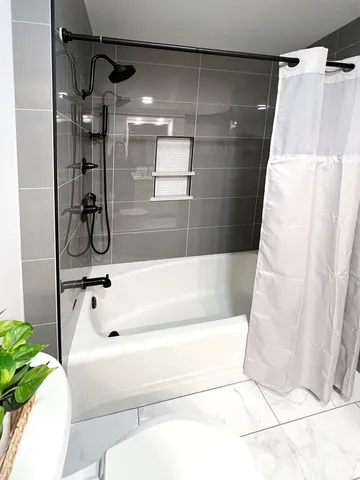 a view of a living room and entry way