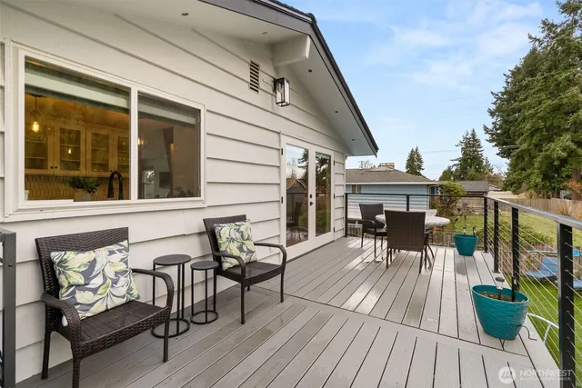 a view of outdoor space with deck and yard