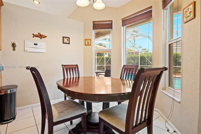a view of a dining room with furniture window and outside view