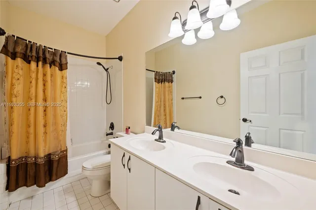 a bathroom with a sink a double vanity and a mirror