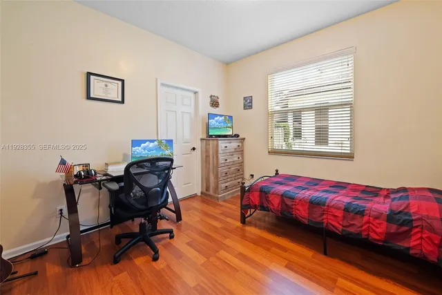 a bedroom with a workspace