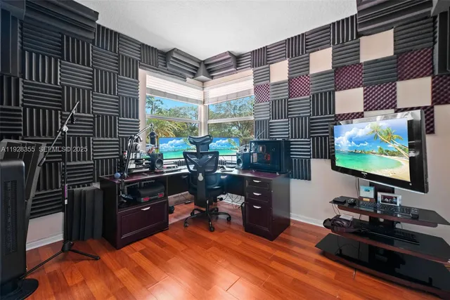 a room with furniture flat screen tv and windows