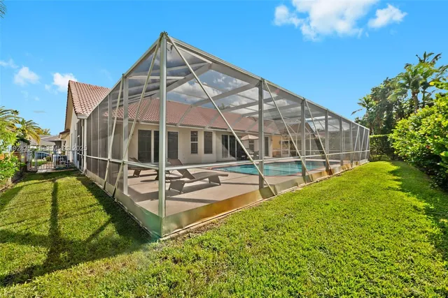 a view of house with swimming pool