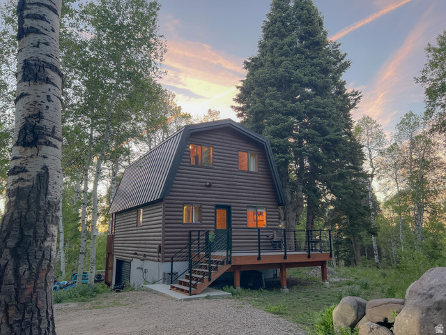 11237 East Aspen Road, Unit 74 Heber City, UT 84032 - Photo 1 of 32 Cabin-style residence featuring log siding and a gambrel roof