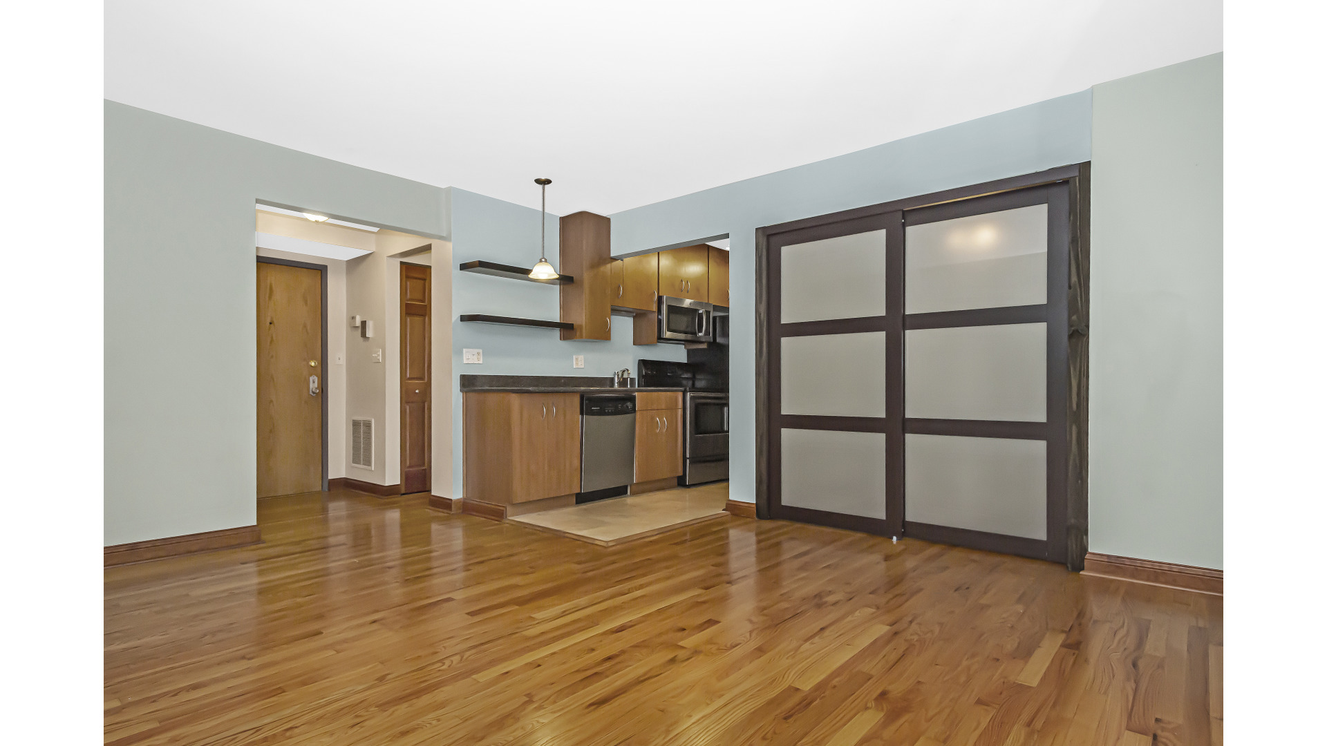 512 West Barry Avenue, Unit 408 Chicago, IL 60657 - Photo 11 of 21 a view of kitchen with wooden floor electronic appliances and window