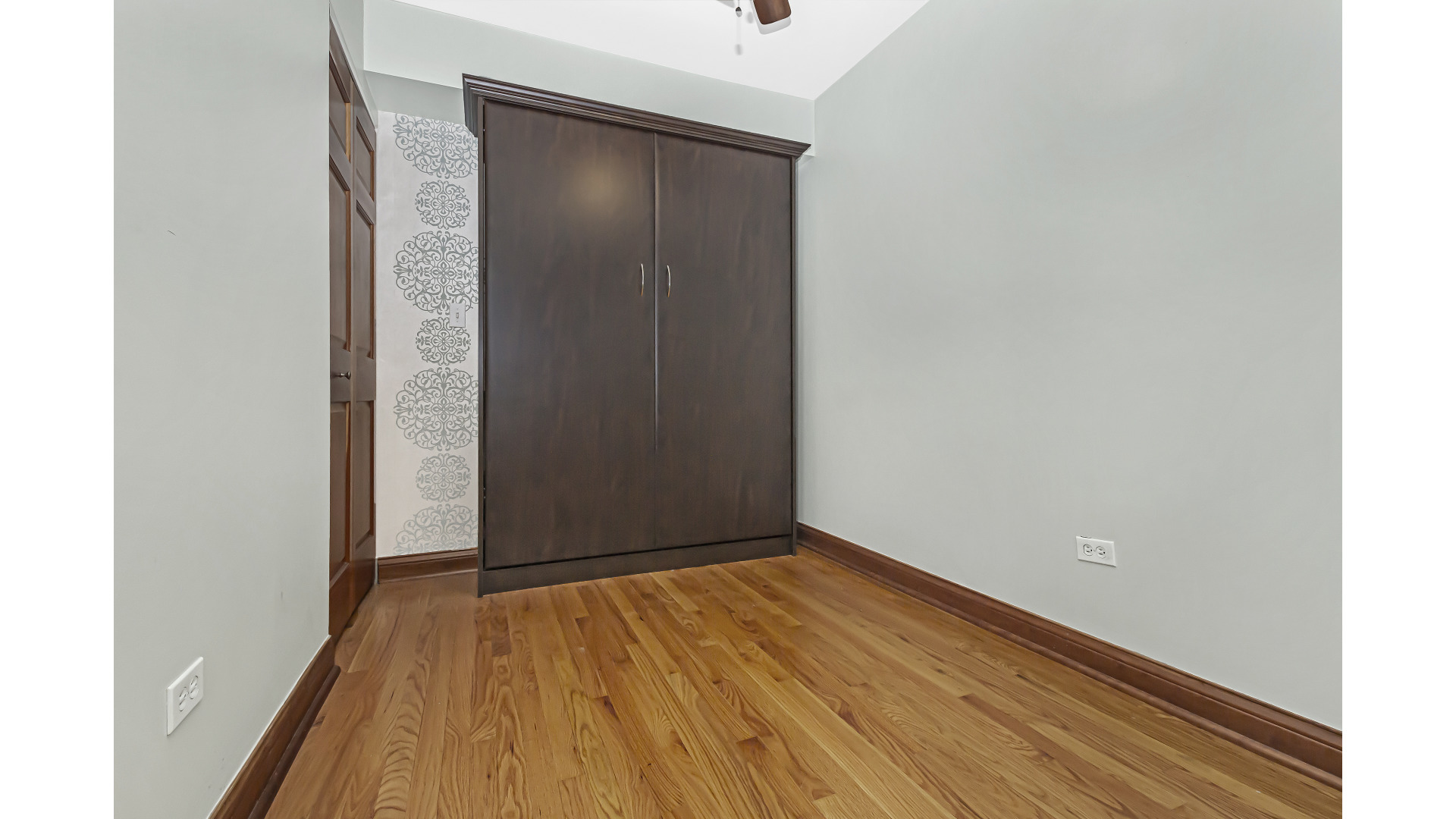 512 West Barry Avenue, Unit 408 Chicago, IL 60657 - Photo 13 of 21 a view of a room with wooden floor