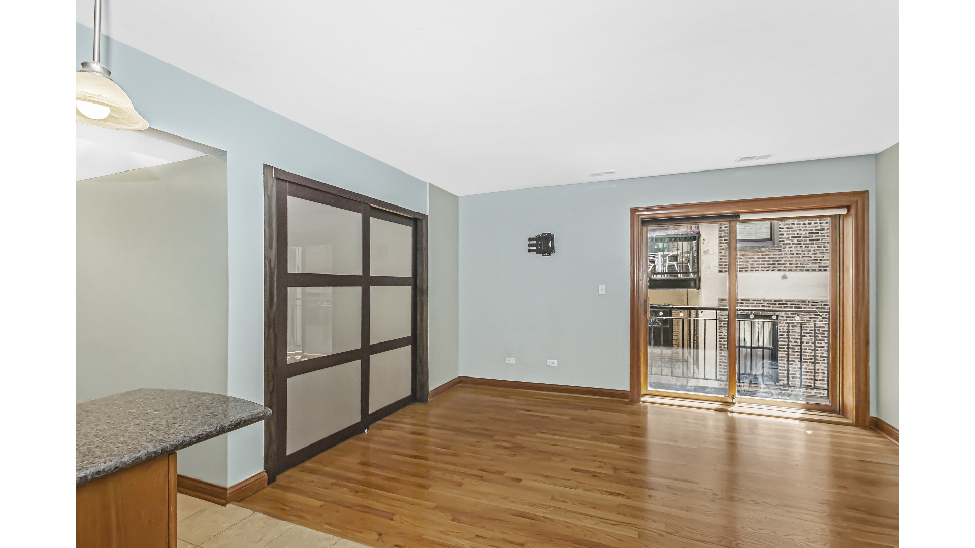 512 West Barry Avenue, Unit 408 Chicago, IL 60657 - Photo 9 of 21 a view of a room with wooden floor and windows