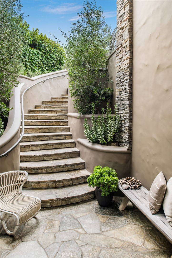 199 Emerald Bay Laguna Beach, CA 92651 - Photo 13 of 33 a view of a balcony with chair and potted plants