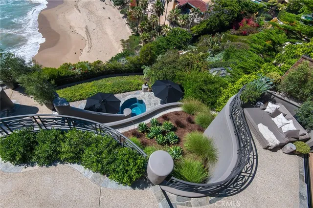 a view of a backyard with plants and outdoor seating