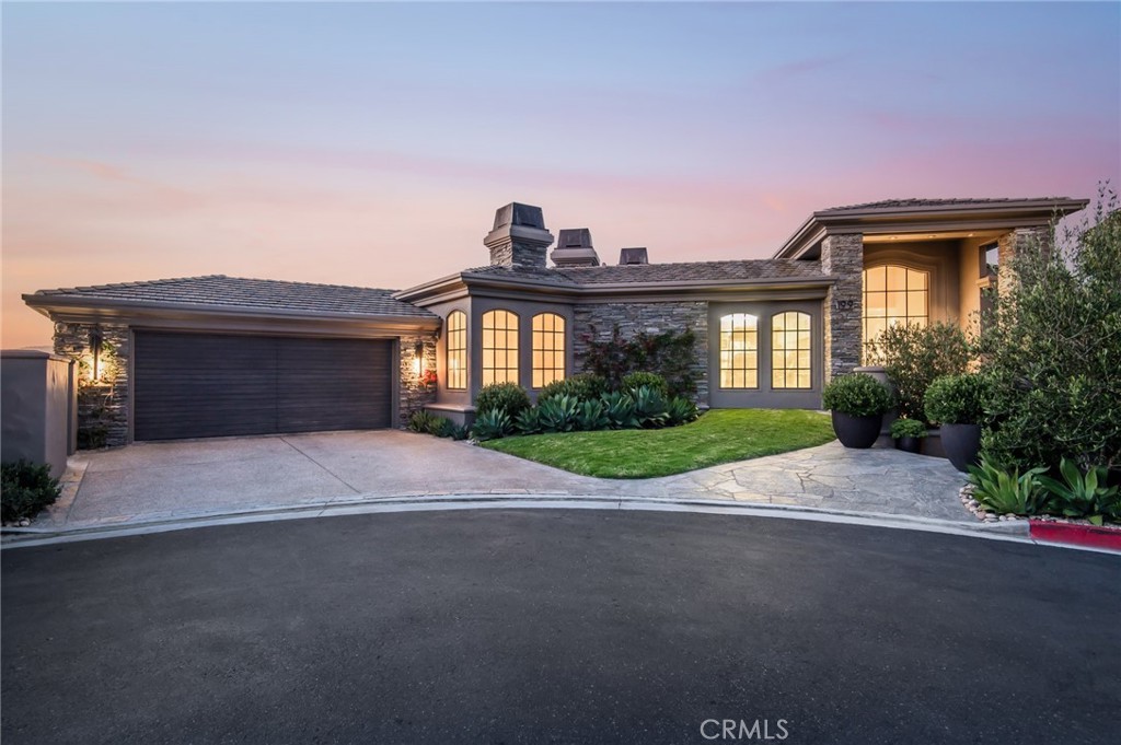 199 Emerald Bay Laguna Beach, CA 92651 - Photo 28 of 33 a front view of a house with a yard and a garage