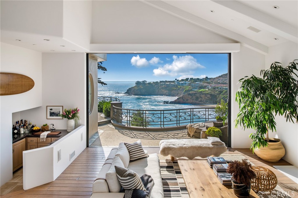 199 Emerald Bay Laguna Beach, CA 92651 - Photo 5 of 33 a living room with furniture a rug and a large window