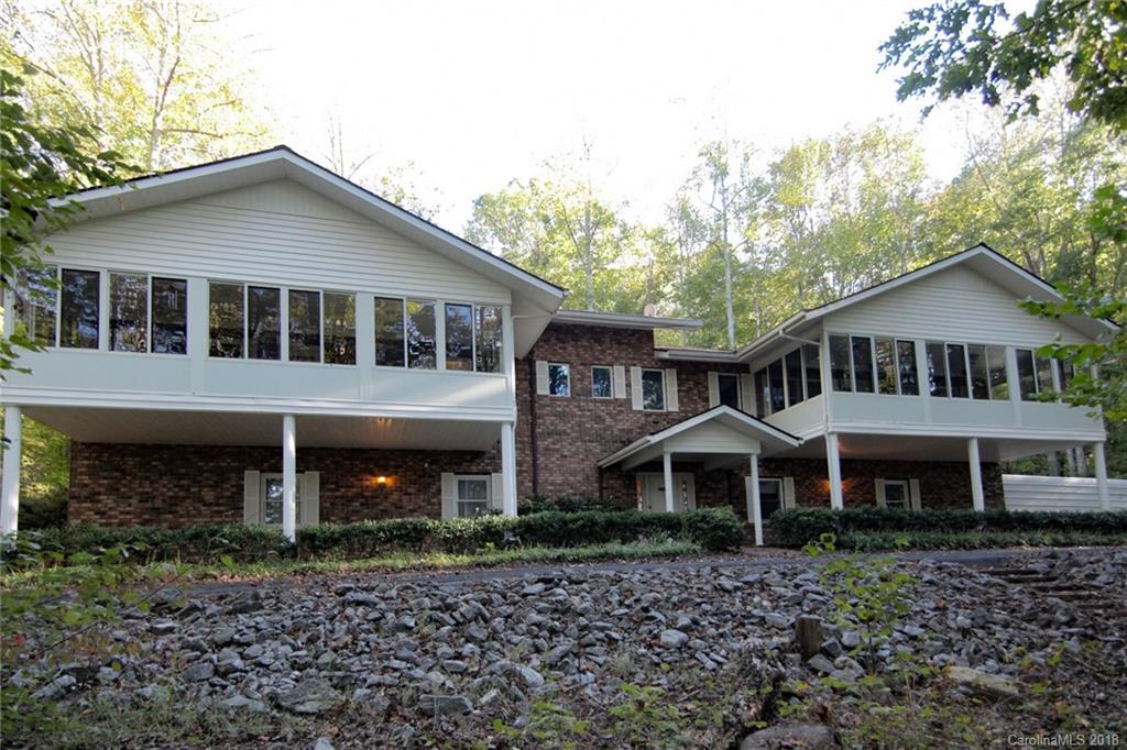 503 Jim Dobbins Road Rutherfordton, NC 28139 - Photo 2 of 34 a front view of a house with a yard and balcony