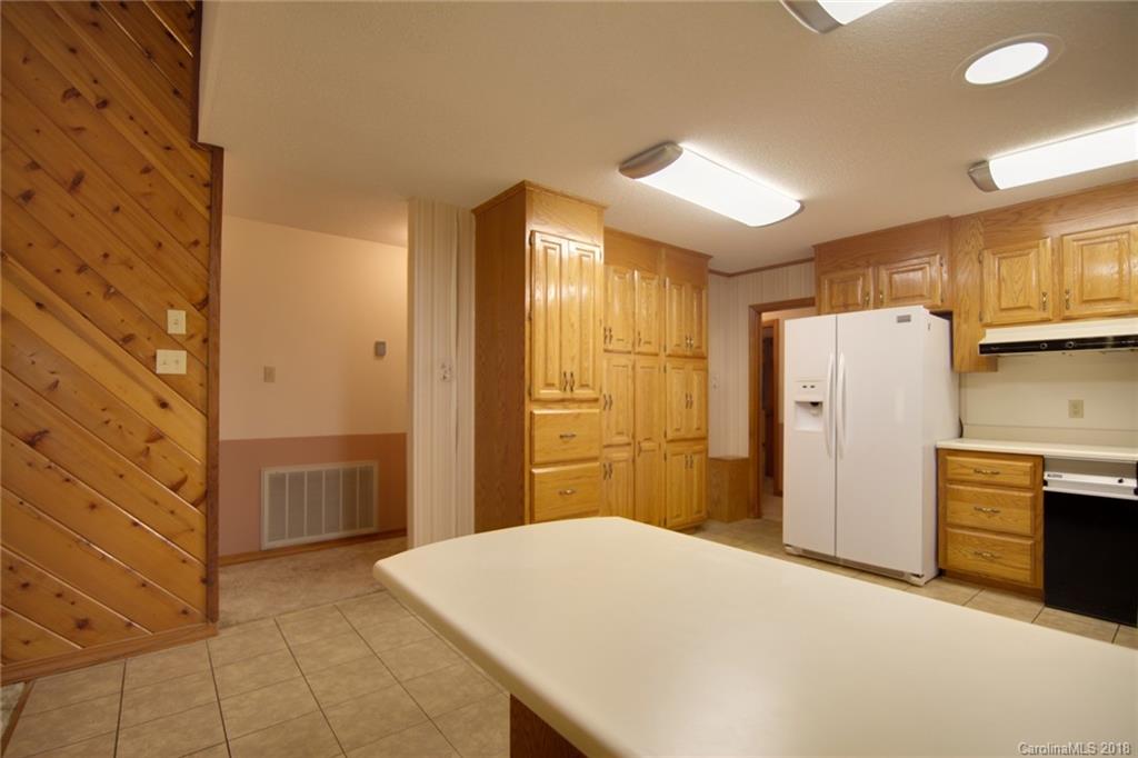 503 Jim Dobbins Road Rutherfordton, NC 28139 - Photo 15 of 34 a bedroom with a refrigerator and a sink