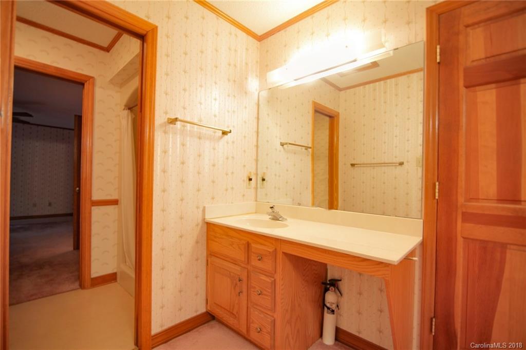 503 Jim Dobbins Road Rutherfordton, NC 28139 - Photo 25 of 34 a bathroom with a sink and a mirror