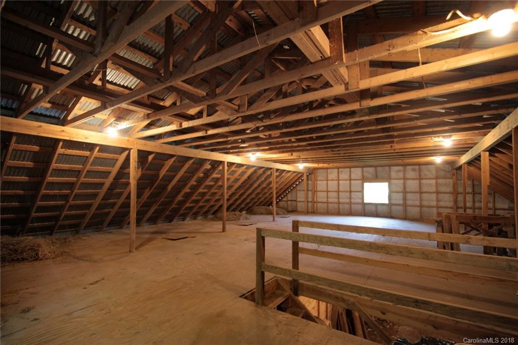 503 Jim Dobbins Road Rutherfordton, NC 28139 - Photo 32 of 34 a view of an empty room with wooden walls