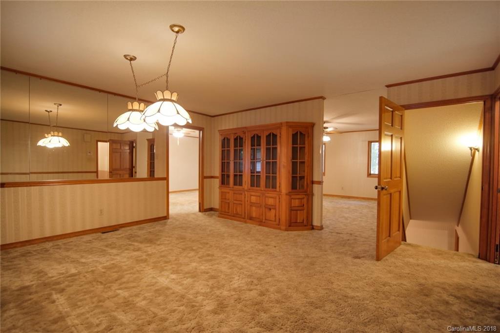 503 Jim Dobbins Road Rutherfordton, NC 28139 - Photo 7 of 34 a view of a big room with a chandelier fan and windows