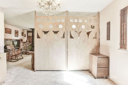 242 Peg Street Ridgecrest, CA 93555 - Photo 8 of 32 a view of a livingroom with furniture and a hallway