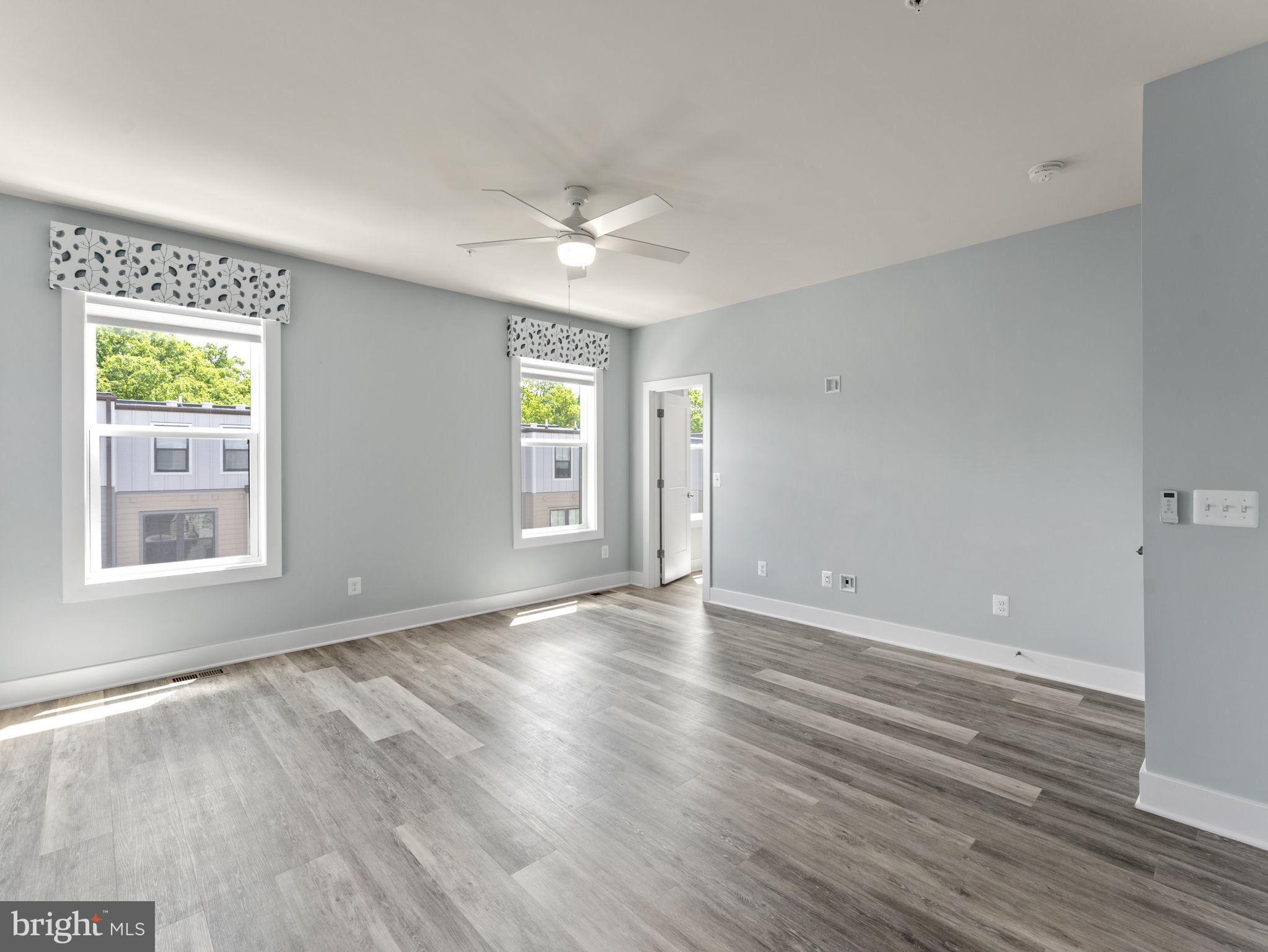 1616 Bandit Loop, Unit 10B Reston, VA 20190 - Photo 11 of 24 a view of empty room with wooden floor and fan