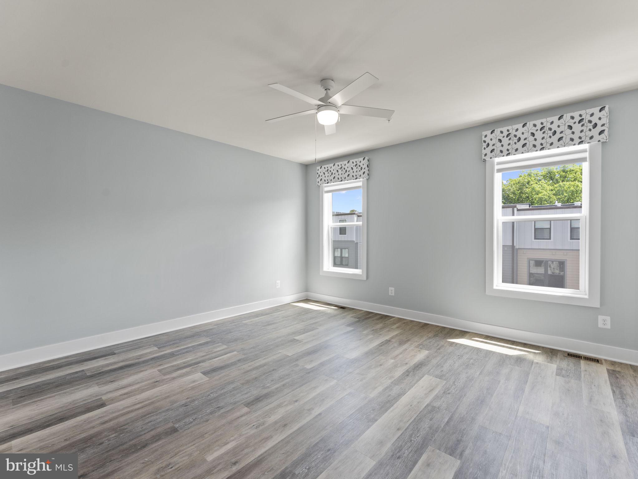1616 Bandit Loop, Unit 10B Reston, VA 20190 - Photo 12 of 24 wooden floor in an empty room with a window