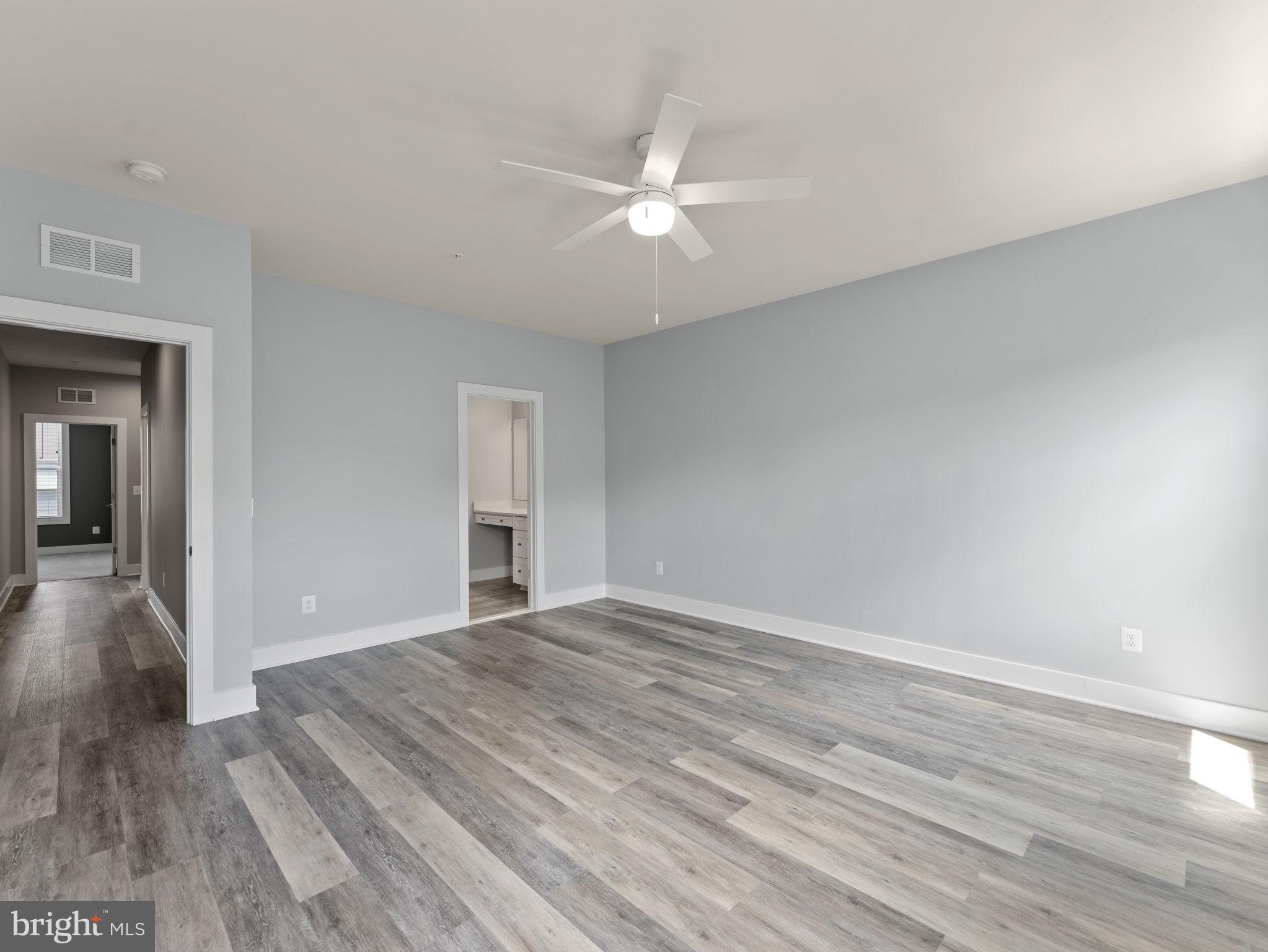 1616 Bandit Loop, Unit 10B Reston, VA 20190 - Photo 13 of 24 a view of an empty room with wooden floor