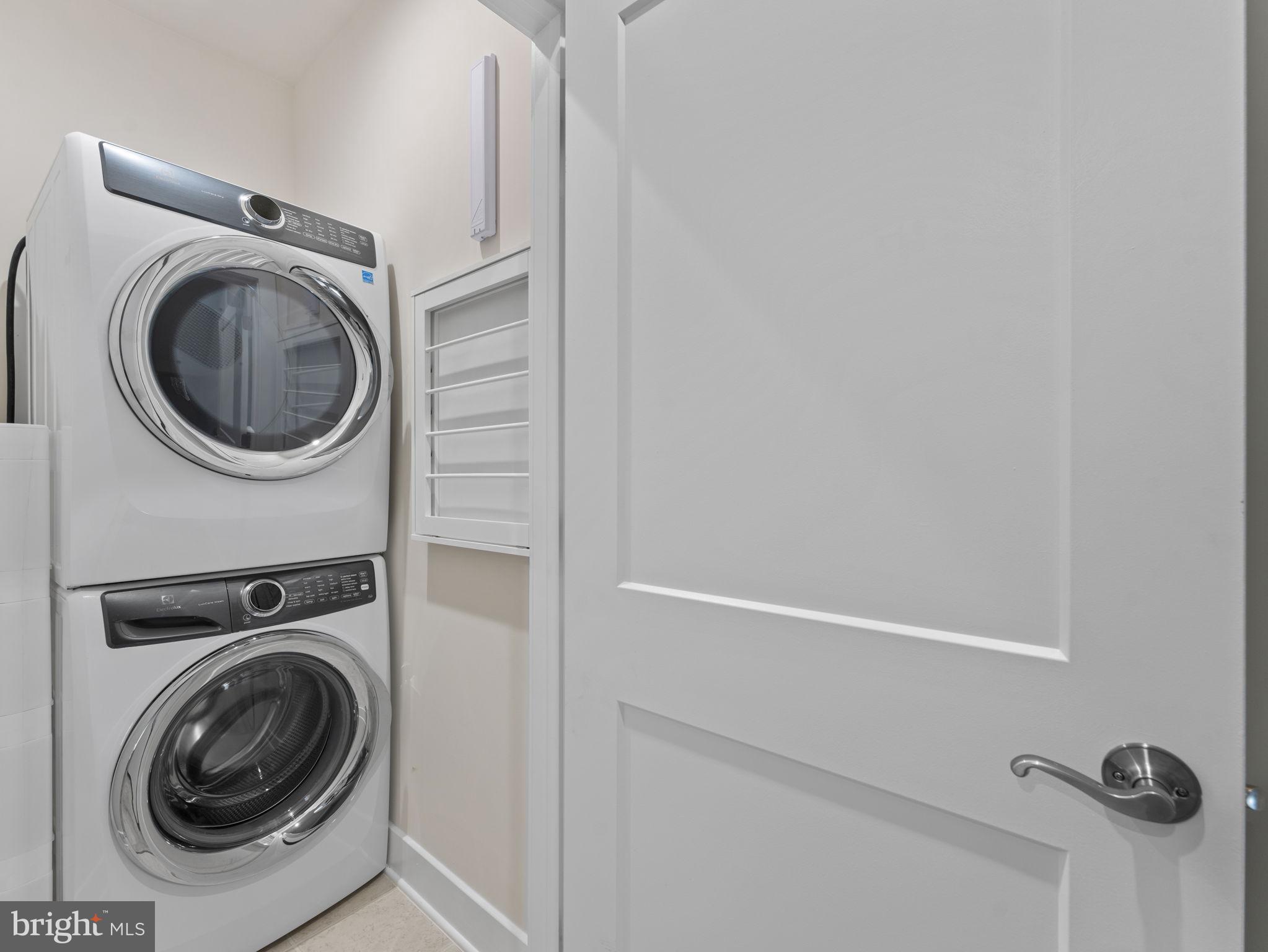 1616 Bandit Loop, Unit 10B Reston, VA 20190 - Photo 16 of 24 a utility room with dryer and washer