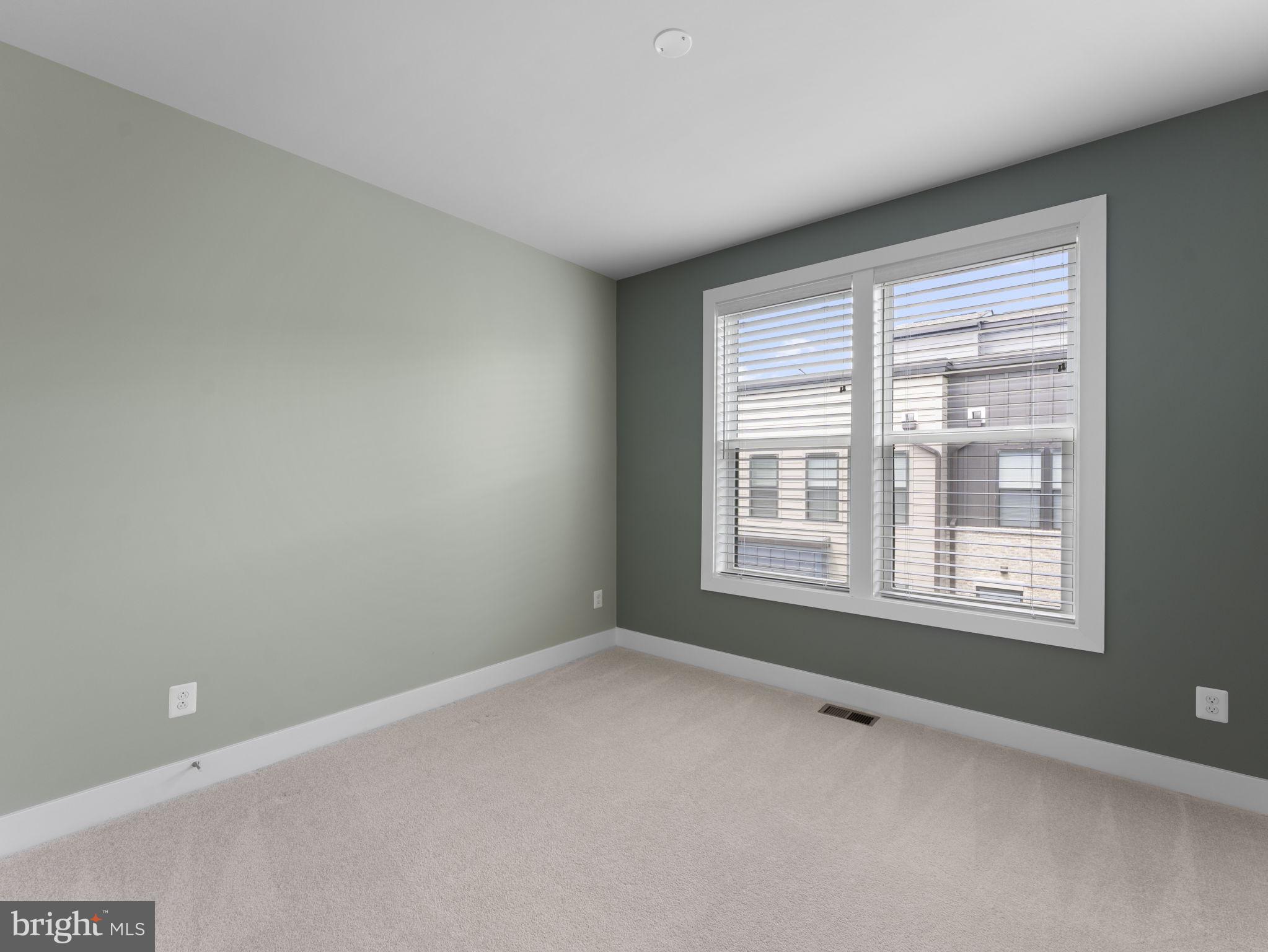 1616 Bandit Loop, Unit 10B Reston, VA 20190 - Photo 18 of 24 a view of an empty room with a window