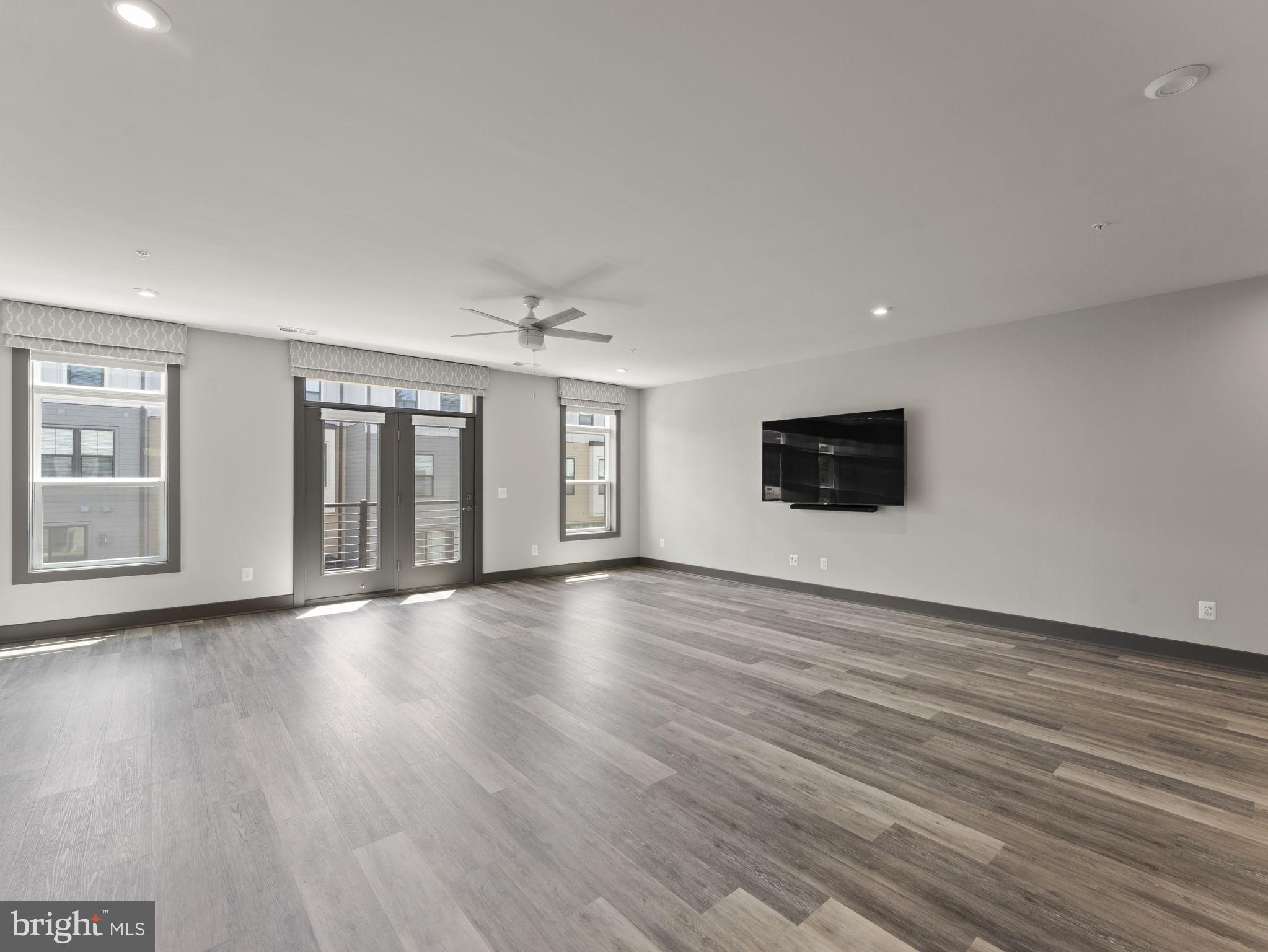 1616 Bandit Loop, Unit 10B Reston, VA 20190 - Photo 3 of 24 a view of an empty room with wooden floor and a window