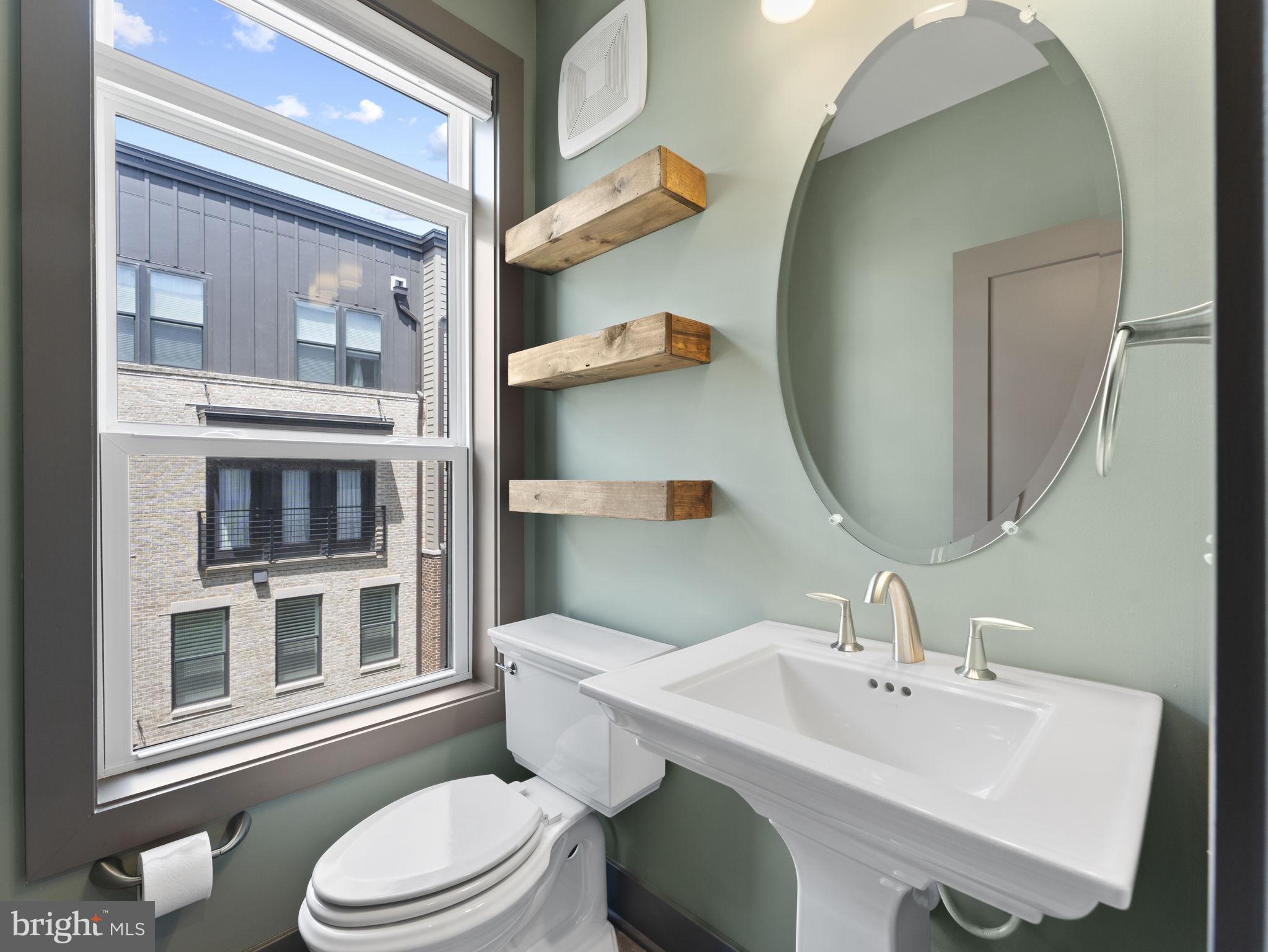 1616 Bandit Loop, Unit 10B Reston, VA 20190 - Photo 10 of 24 a bathroom with a sink a toilet and mirror