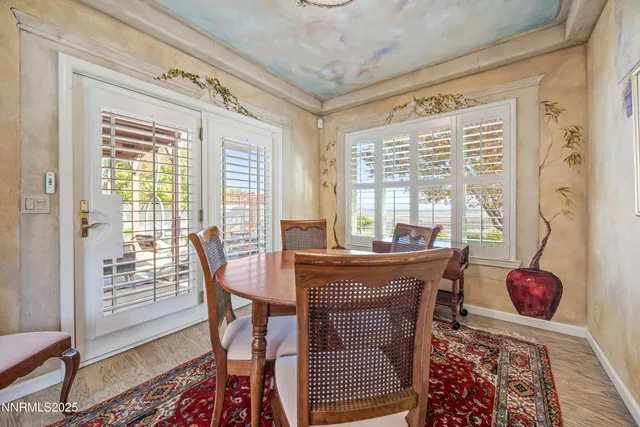 a dining room with furniture and window