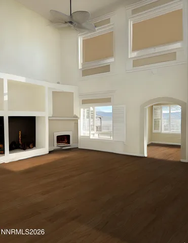 a bedroom with a bed and a television