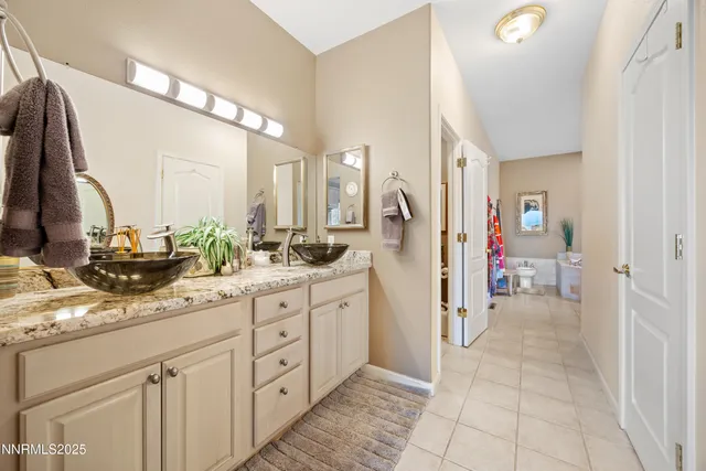 a bathroom with a sink and mirror