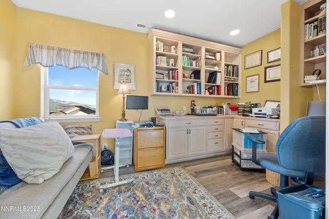 a workspace with furniture and window