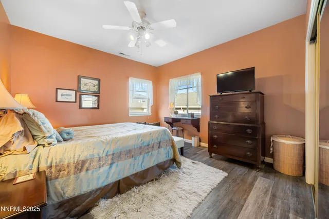 a bedroom with a bed and a television