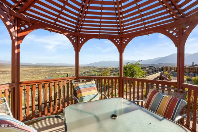 a view of a chairs and table in a patio