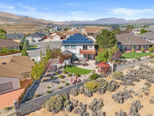 an aerial view of a house with a garden