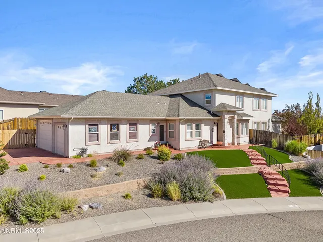 a living room with a bed furniture and a window