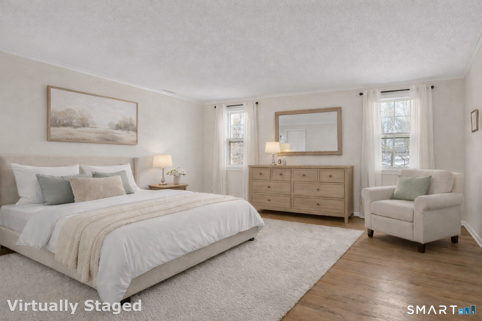 2 Esterly Farms Road, Unit 2 Madison, CT 06443 - Photo 15 of 40 Step into the expansive primary bedroom suite, a truly magnificent space that immediately impresses with its generous size. It comfortably accommodates a king-size bed and provides ample room for a cozy sitting area. Virtually Staged.