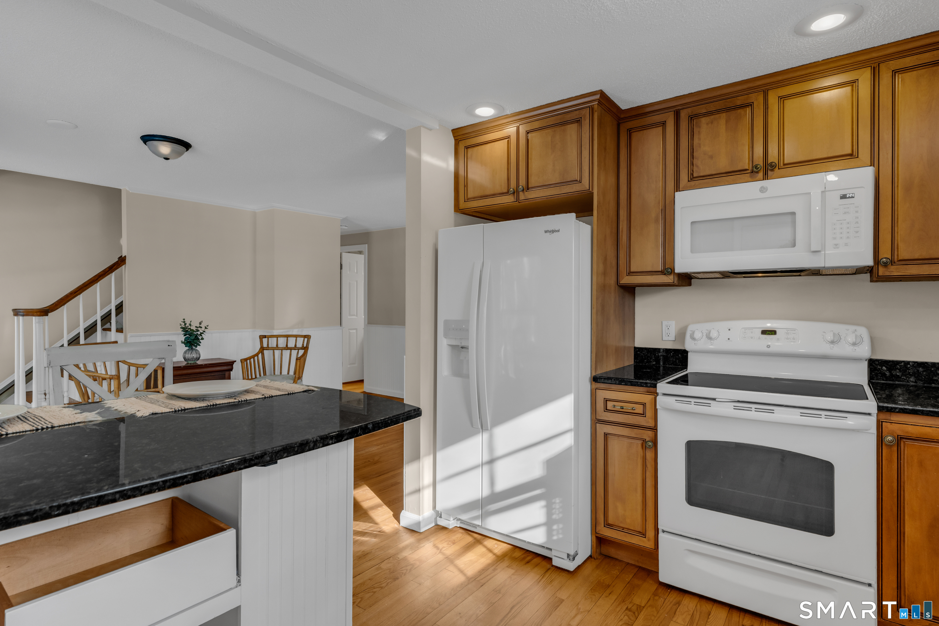 2 Esterly Farms Road, Unit 2 Madison, CT 06443 - Photo 2 of 40 a kitchen with a sink stove and refrigerator