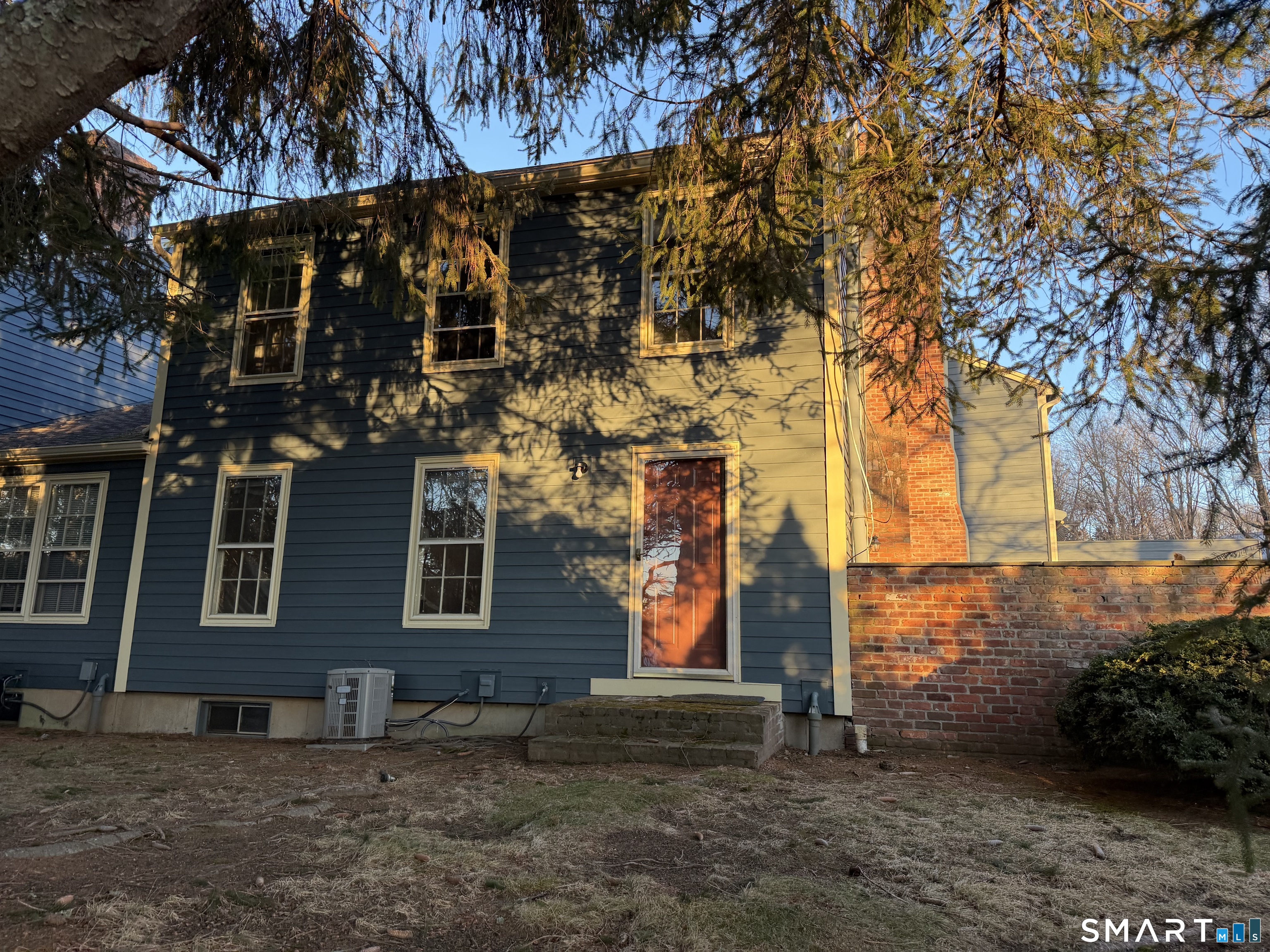 2 Esterly Farms Road, Unit 2 Madison, CT 06443 - Photo 4 of 5 Side door off the kitchen.