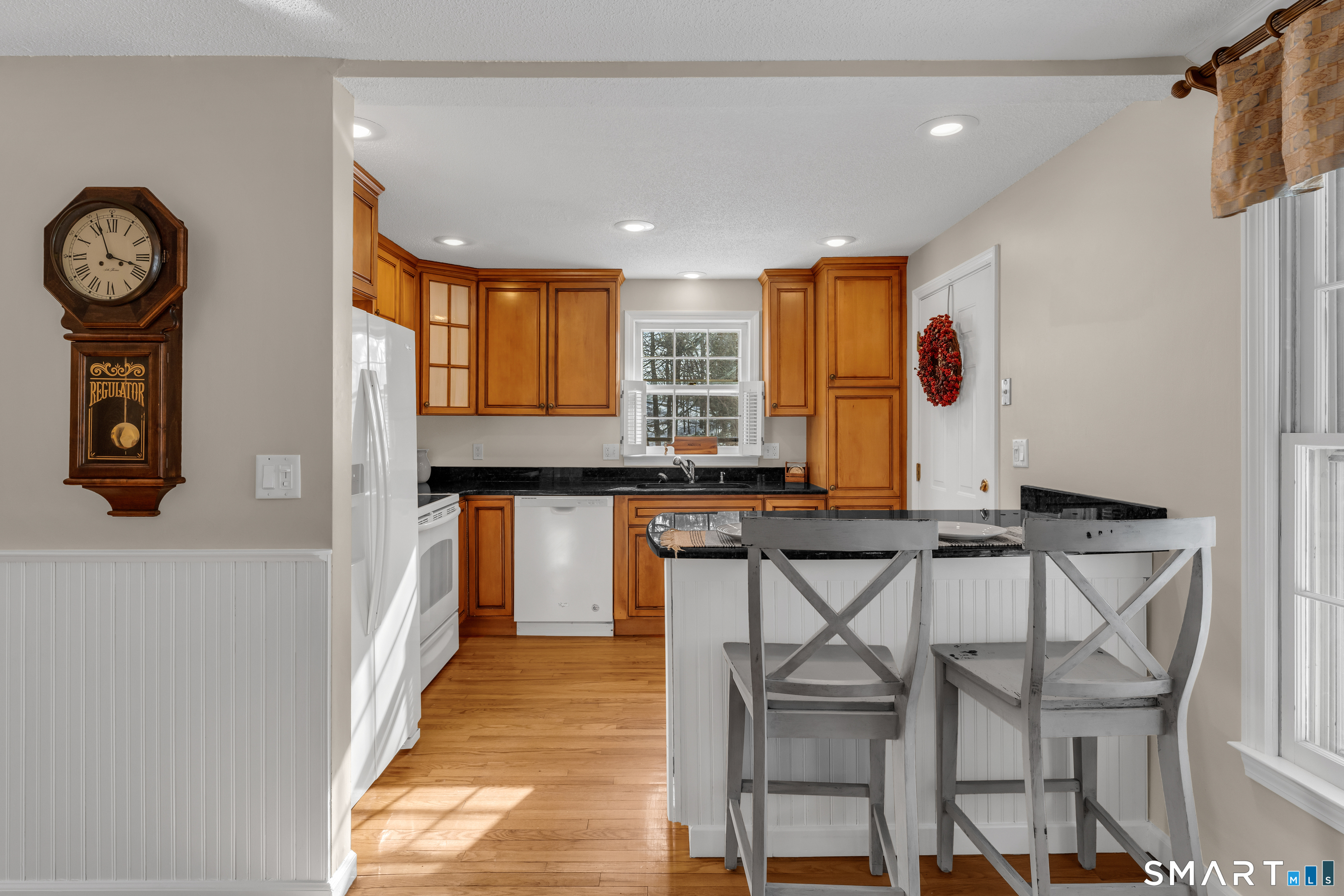 2 Esterly Farms Road, Unit 2 Madison, CT 06443 - Photo 8 of 40 The kitchen features a peninsula, offering a great space for casual dining or extra counter space for meal preparation.